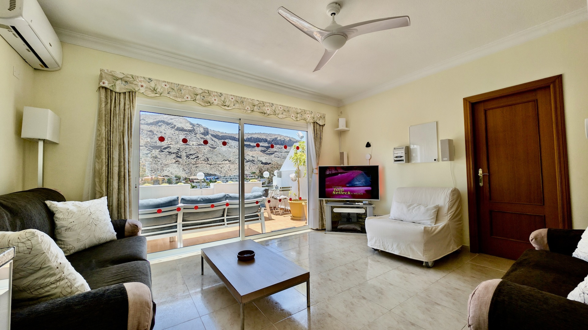 Lounge and living area inside Filin Apartment with seating and terrace view